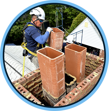a chimney worker on a roof repairing a chimney